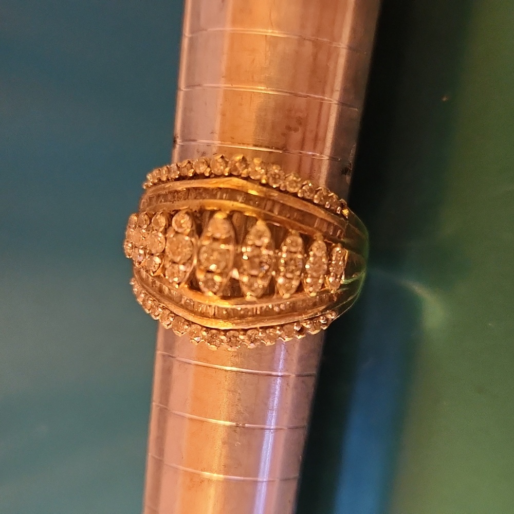 Size 7 Diamonds all around. Cocktail ring or engagement bling.